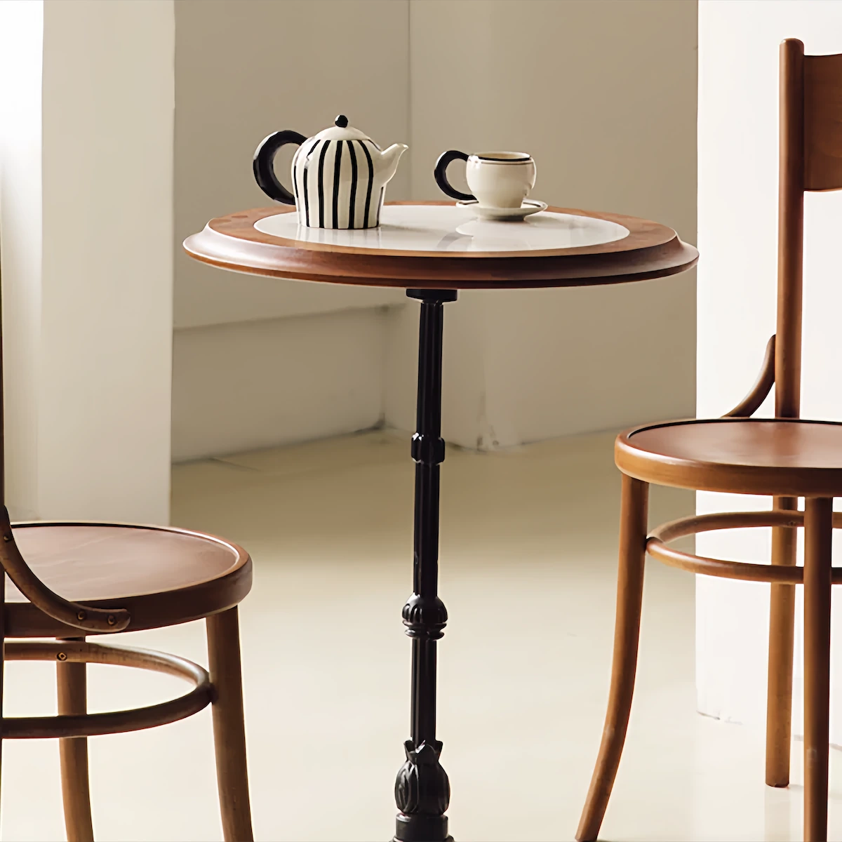 Round Sintered Stone Bistro Table with Iron Pedestal Base — view 1