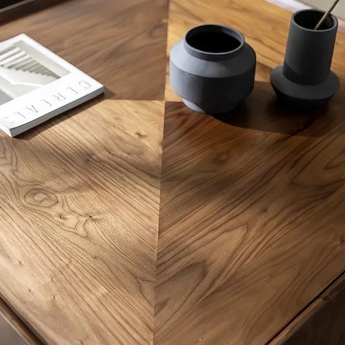 Close-up of the geometric walnut veneer tabletop grain