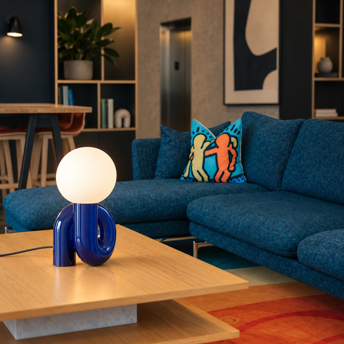 The blue loop picks up a blue sofa without matching every surface.