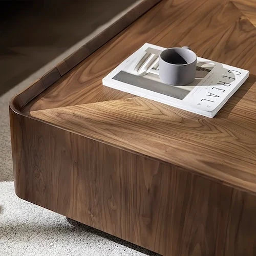 Close view of the walnut veneer coffee table edge and rounded corner