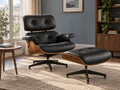 Black lounge chair and ottoman beside a window